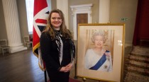 A transformed Kalleen posing with Her Maj